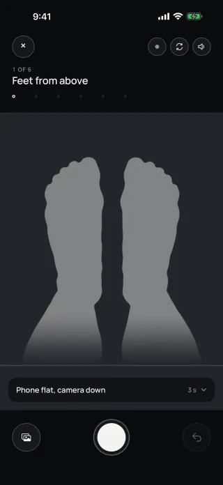 The app's scan, photo 1 of 6: the feet from above, with an outline to stand in and a count-in.